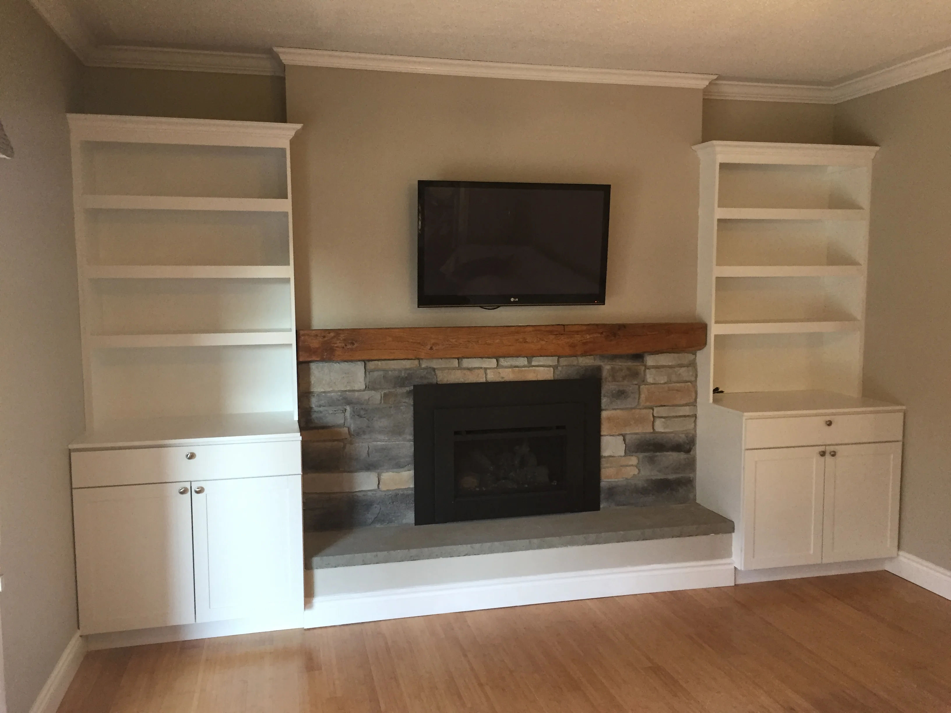 White painted mantel with tiled hearth and cast iron stove insert